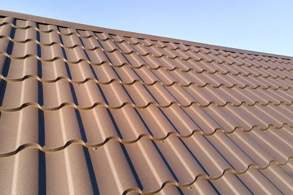 Closeup of house roof top covered with metallic shingles — Stockfoto