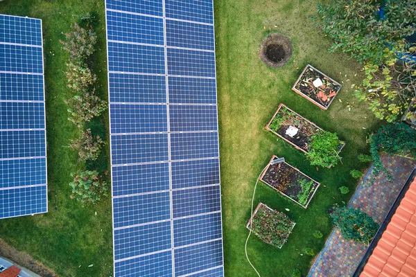 Solar photovoltaic panels mounted on stand-alone frame on backyard ground for generating of clean ecological electric energy. Concept of autonomous house — Stock Photo, Image