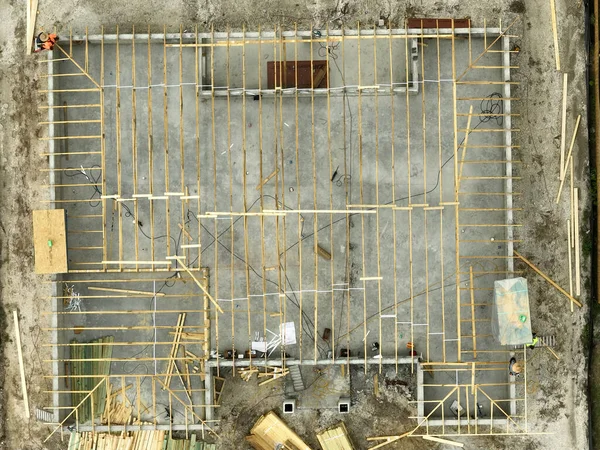 Aerial view of suburban private house wit wooden roof frame under construction in Florida quiet rural area.