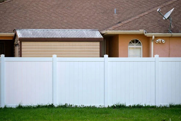 White Plastic Fence Back Yard Protection Privacy — стоковое фото