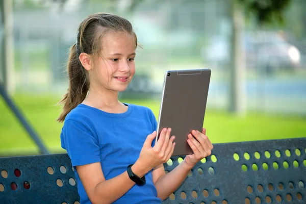 Young Cute Smiling Teenager Girl Looking Screen Digital Tablet Sitting — Stockfoto