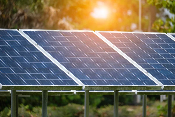 Solar panels installed on stand frame near parking lot for effective generation of clean electricity. Photovoltaic technology integrated in urban infrastructure for electric car charging.