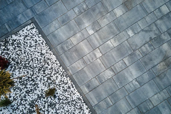 Front or back yard landscape design of stone tile pavement. Exterior from above.