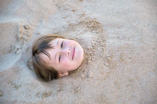 Young Smiling Child Girl Lying Covered White Sand Tropic Beach — Photo