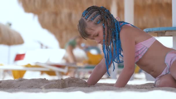 Pretty Child Girl Bikini Swimsuit Playing Sand Umbrella Shadow Summer — стоковое видео