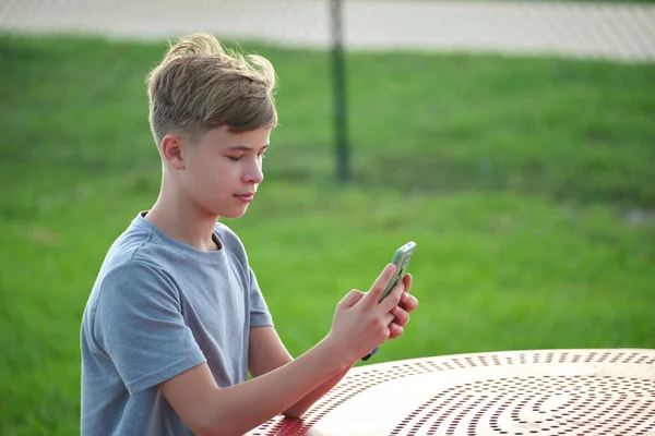 Young Handsome Teenager Boy Using Smartphone Outdoors Sunny Summer Day — Foto Stock