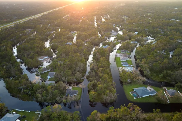 Surrounded by hurricane Ian rainfall flood waters homes in Florida residential area. Consequences of natural disaster.
