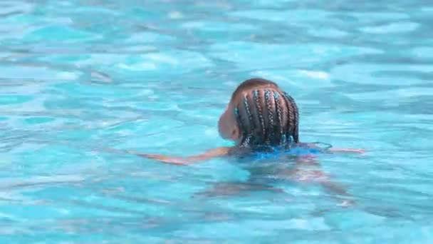 Child Girl Learns Swim Funny Face Closed Eyes Bright Blue — Vídeo de Stock