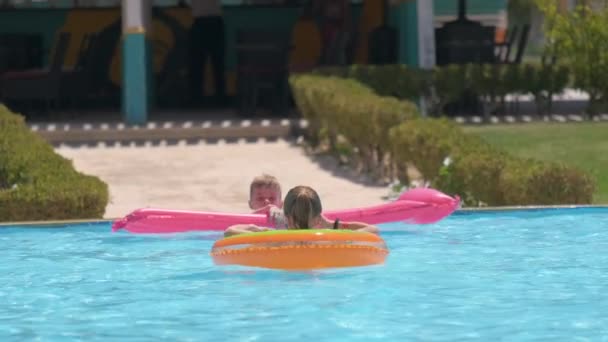 Young Joyful Children Boy Girl Having Fun Swimming Inflatable Air — Stock Video