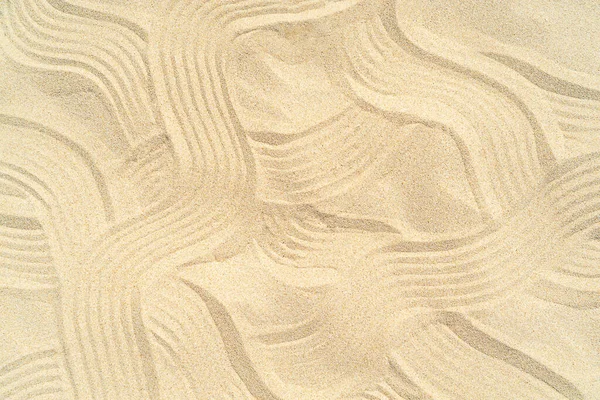 Drawing of waves on the sand on the beach, sand pattern — Stock Photo, Image