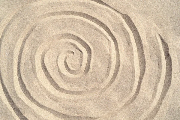 Texture di fondo sabbia marina primo piano con ornamento Foto Stock