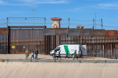 Central American migrants detained by border patrol after they irregularly crossed the border to seek humanitarian asylum in the United States clipart