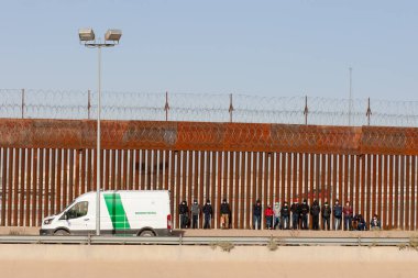 Central American migrants detained by border patrol after they irregularly crossed the border to seek humanitarian asylum in the United States clipart