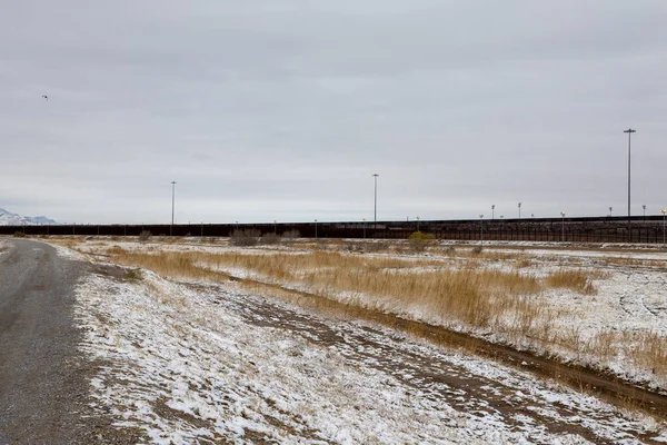 Snowy landscape of the wall that divides Mexico from the United States on the border between Ciudad Jurez and Paso Texas,