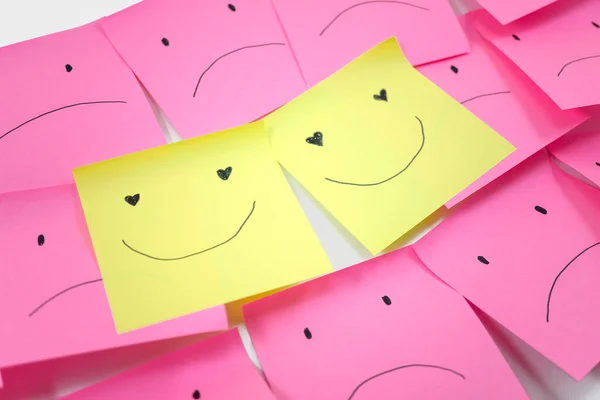 conceptual image for happy couple among unhappy community with the couple, concept of using sticky notes.