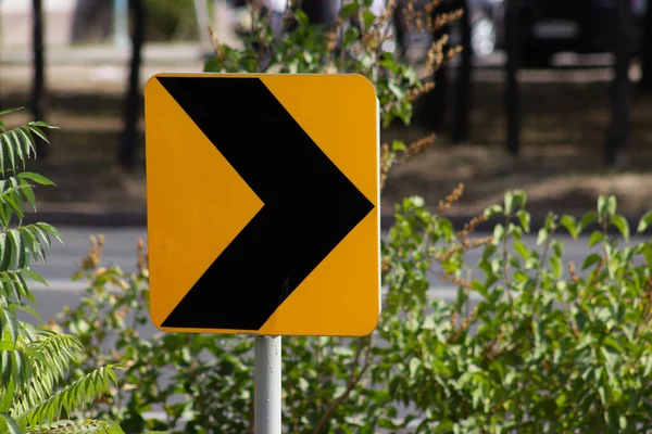 Turn road traffic direction yellow sign