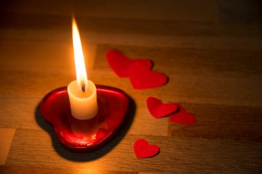 candle light in heart shape plate