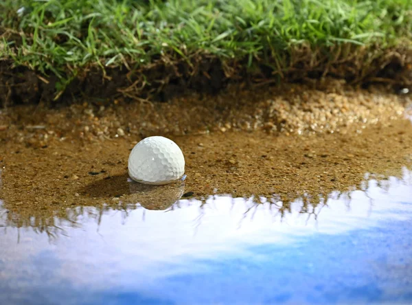 golf ball in water hazard