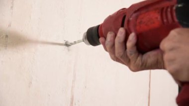 man hand use electric drill 