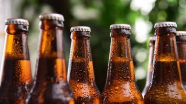  man hand picking cold beer bottle