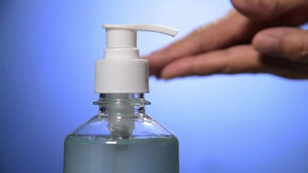 Hand White Liquid Soap Dispenser Blue Background — Stock Video