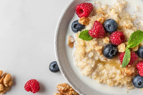 Quinoa Porridge Fresh Blueberry Raspberry Walnuts Honey Mint Bowl White — Stock Photo, Image