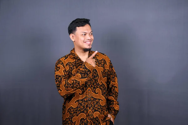 Portrait Happy Young Man Batik Indonesia Pointing Fingers Away Copy — Stock Photo, Image
