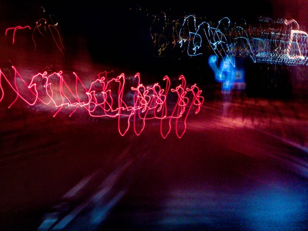 Luminous Beings Dancing Street Long Exposure Moving Car Lights Road — Stock Photo, Image