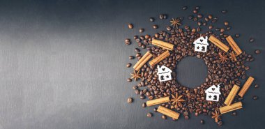 Coffee with spices and Christmas decor. Winter holidays concept. Season of greetings. Cosiness. Hot coffee with cinnamon and star anise.Top view. Flat lay. Copyspace. Banner. Wide coffee background