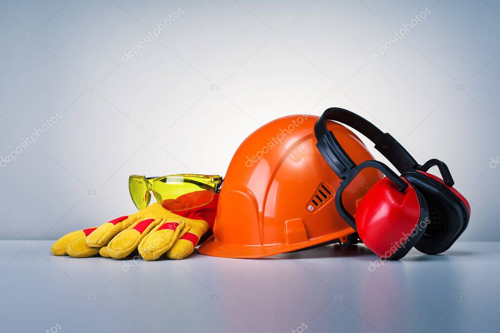 Personal Protective Equipment On Grey Background. Work Safety Concept.