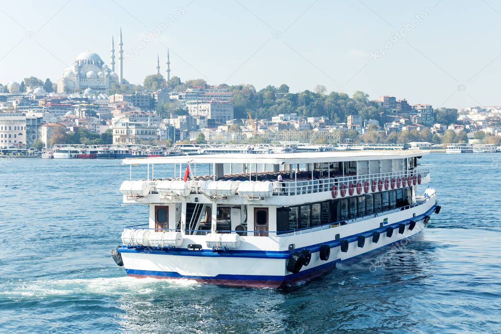 Touristic passenger ship in Istanbul, Turkey. Public water transport in Istanbul. Summer vacation in Turkey.