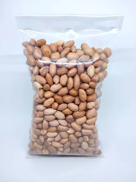Peanuts wrapped in plastic packaging. Peanuts can be boiled to be eaten directly, or in addition to vegetables, or as a traditional Indonesian food peanut sauce.