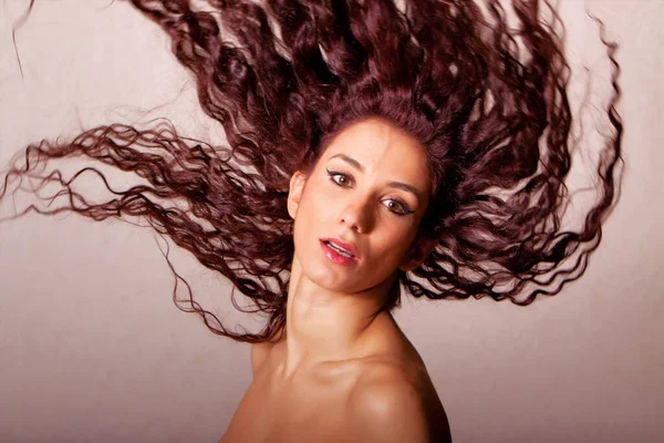 Beautiful Young Ethnic Woman Flipping Her Long Curly Hair — Stock Photo, Image