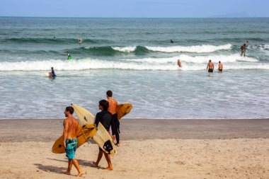 Sao Sebastiao, Sao Paulo, Brazil, May 17, 2015. Surfer with his board prepares his entry into the sea at Cambury beach in Sao Sebastiao, north coast of the State of Sao Paulo.
