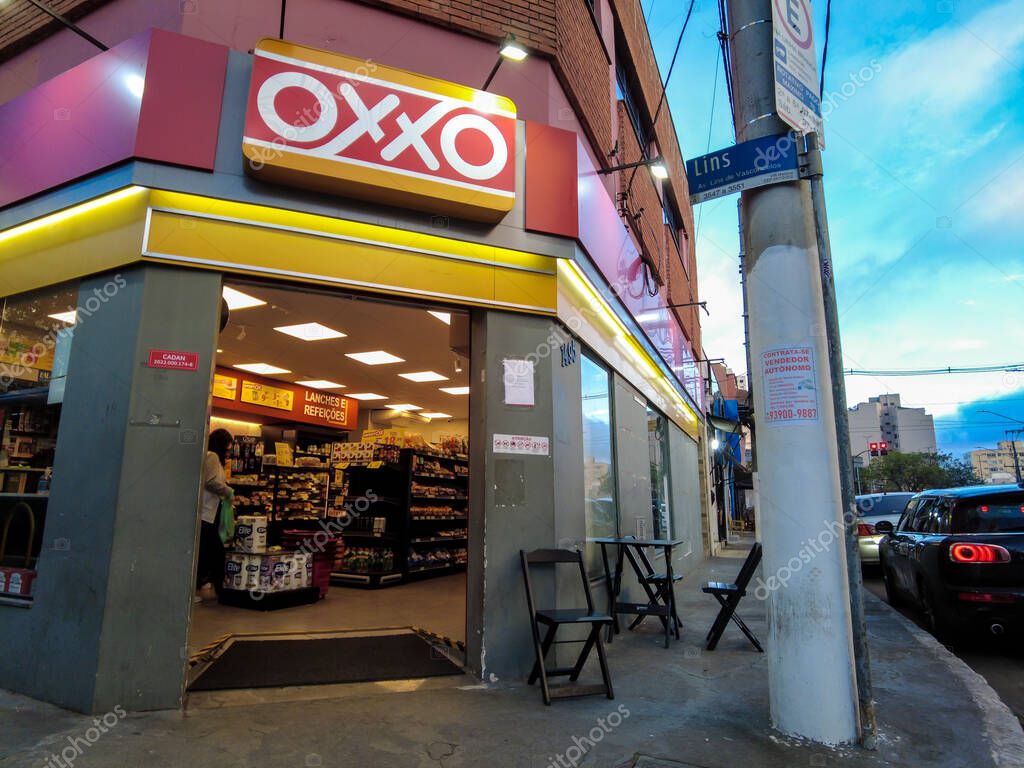 Sao Paulo, Brazil, August 30, 2022. Front view of Oxxo supermarket in Sao Paulo city. Oxxo is popular Mexican chain of grocery stores or