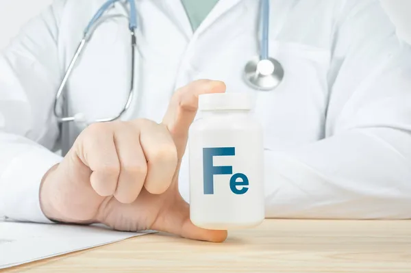 Iron ferrum Fe supplements for human health. Doctor recommends taking Fe ferrum iron. doctor talks about Benefits of ferrum. Essential vitamins and minerals for humans. Iron Health Concept.