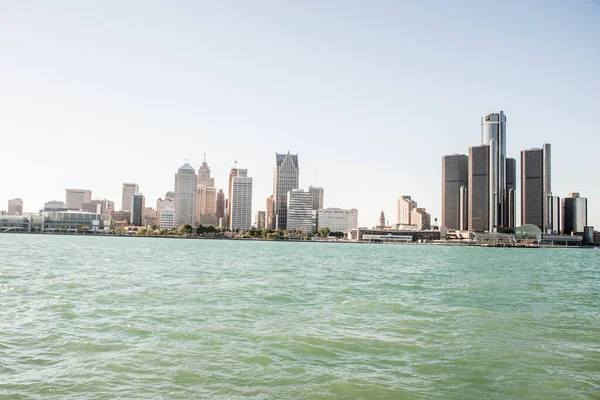 View of the skyline of Downtown Detroit, Michigan from across the Detroit river at the Windsor, Ontario riverfront on a clear day
