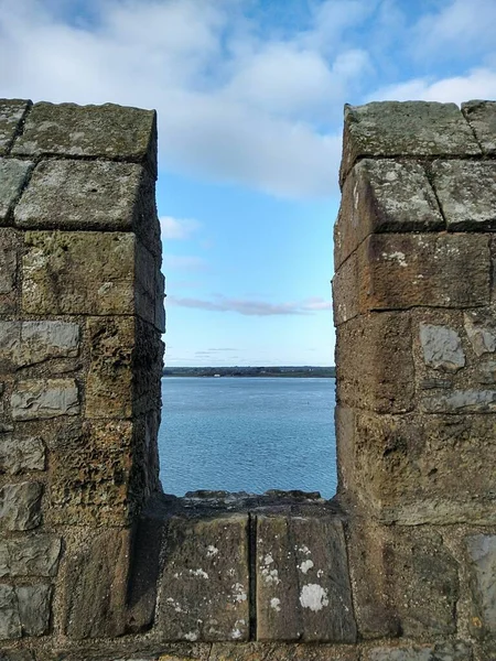 A view over the castle wall of Caernarfon castle in the Gwynedd region of north west Wales