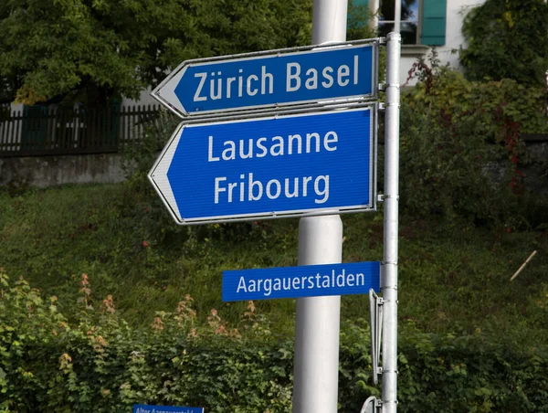 Direction signs to Zurich Basel and Lausanne in Switzerland — Stock Photo, Image