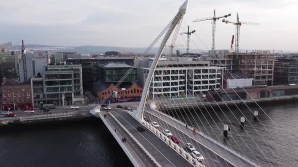 Samuel Beckett Bridge over River Liffey in Dublin - aerial view — Stockvideo