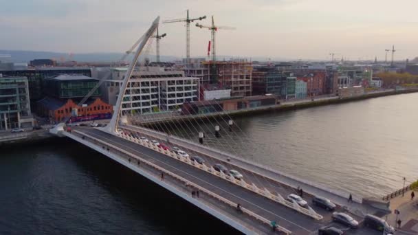 Samuel Beckett Bridge over River Liffey in Dublin - aerial view — Stockvideo