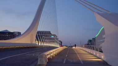 Samuel Beckett Bridge over River Liffey in Dublin - evening view - DUBLIN, IRELAND - APRIL 20, 2022