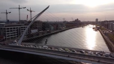Samuel Beckett Bridge over River Liffey in Dublin - aerial view by drone