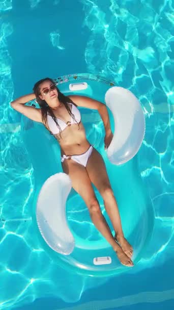 Pretty Girl Lies Air Mattress Swimming Pool View Vertical Video — Stockvideo
