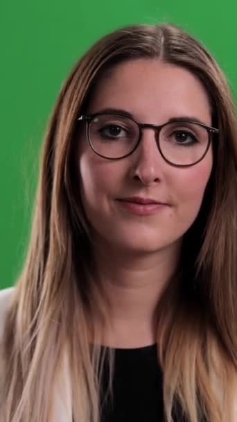 Young Woman Waves Speaks Camera Green Screen Shot Vertical Video — Vídeo de Stock