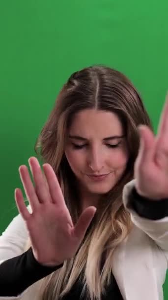 Young Woman Makes Stay Back Leave Alone Gesture Studio Photography — Vídeo de Stock