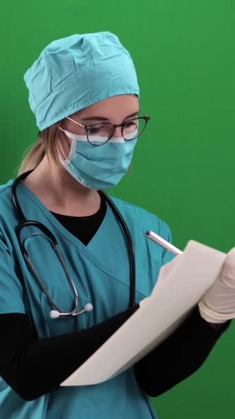 Female Doctor Takes Notes File Studio Photography Vertical Video — Video Stock