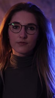 Beauty and fashion shot of a young pretty woman - slow motion shot - Vertical video
