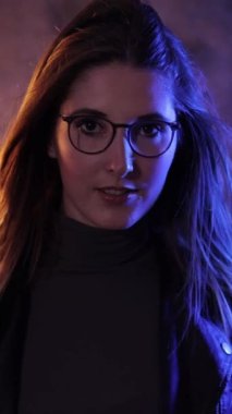 Beauty and fashion shot of a young pretty woman - slow motion shot - Vertical video