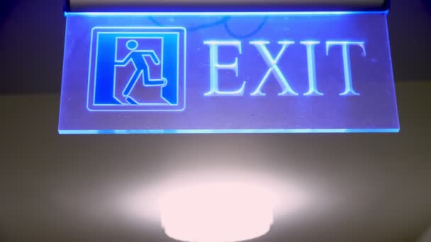 Exit sign. exit icon. close-up. sign with the inscription exit, with blue backlight. — Video Stock